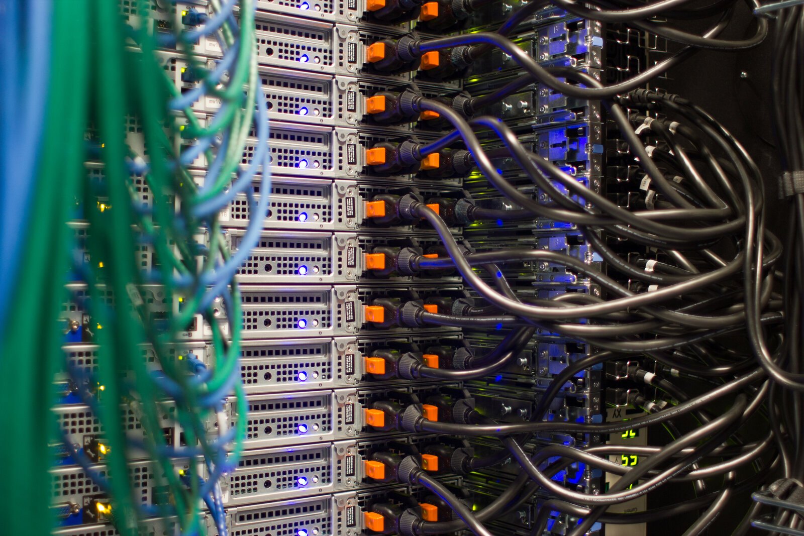 Server racks with network cabling in a data center