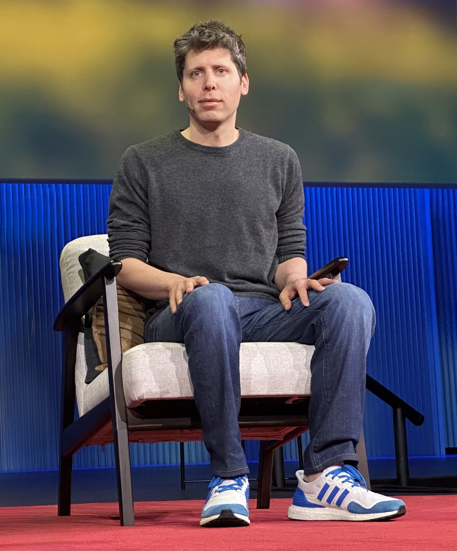 Sam Altman discussing artificial intelligence and agents during a TED talk in 2025