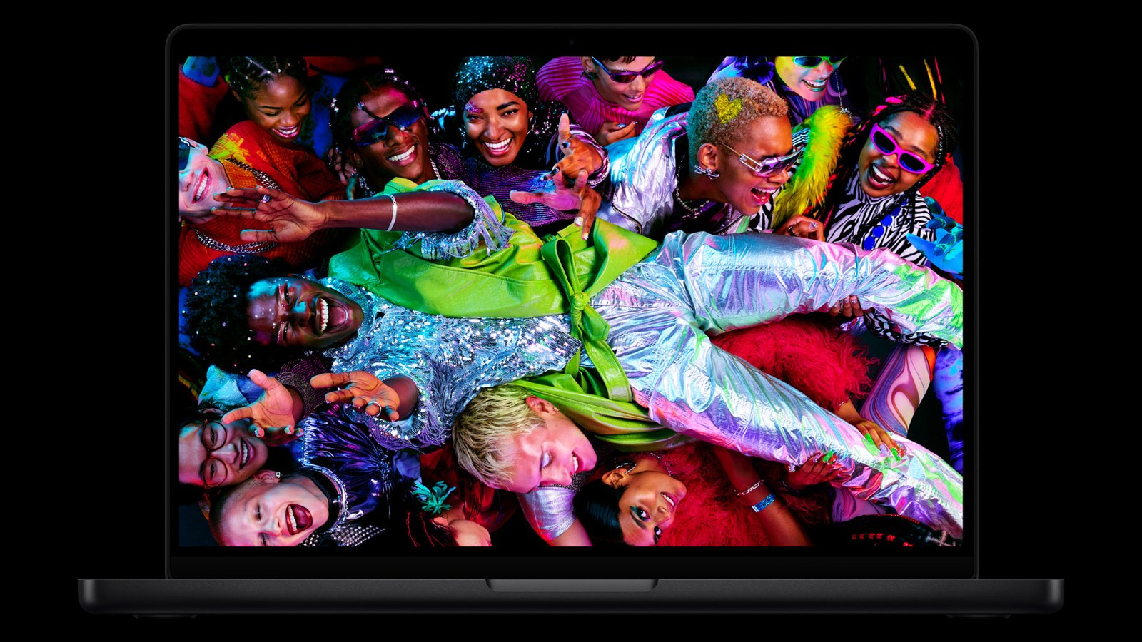 The current MacBook Pro's Liquid Retina XDR display showing a brightly dressed crowd