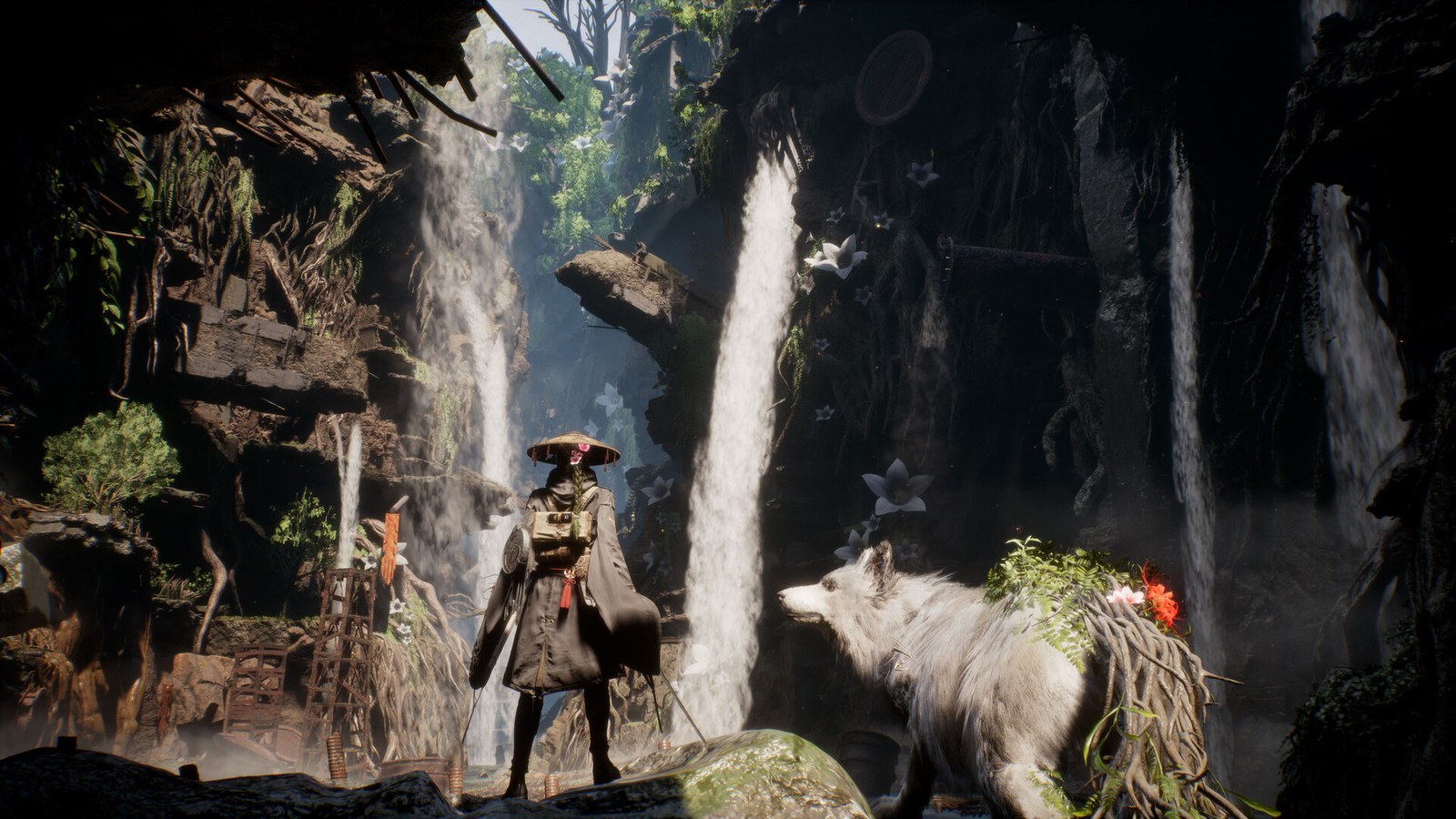 Emma and Koo stand in a grotto surrounded by waterfalls in Beast of Reincarnation
