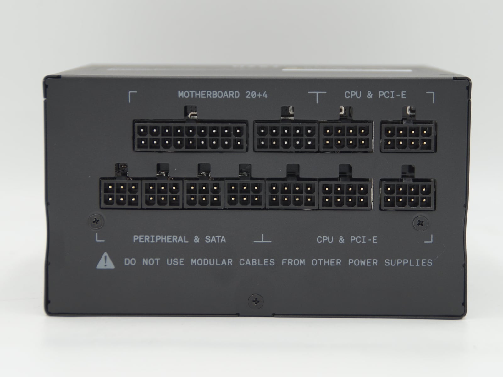 NZXT C850 V2 modular socket panel with a warning about cables from other power supplies