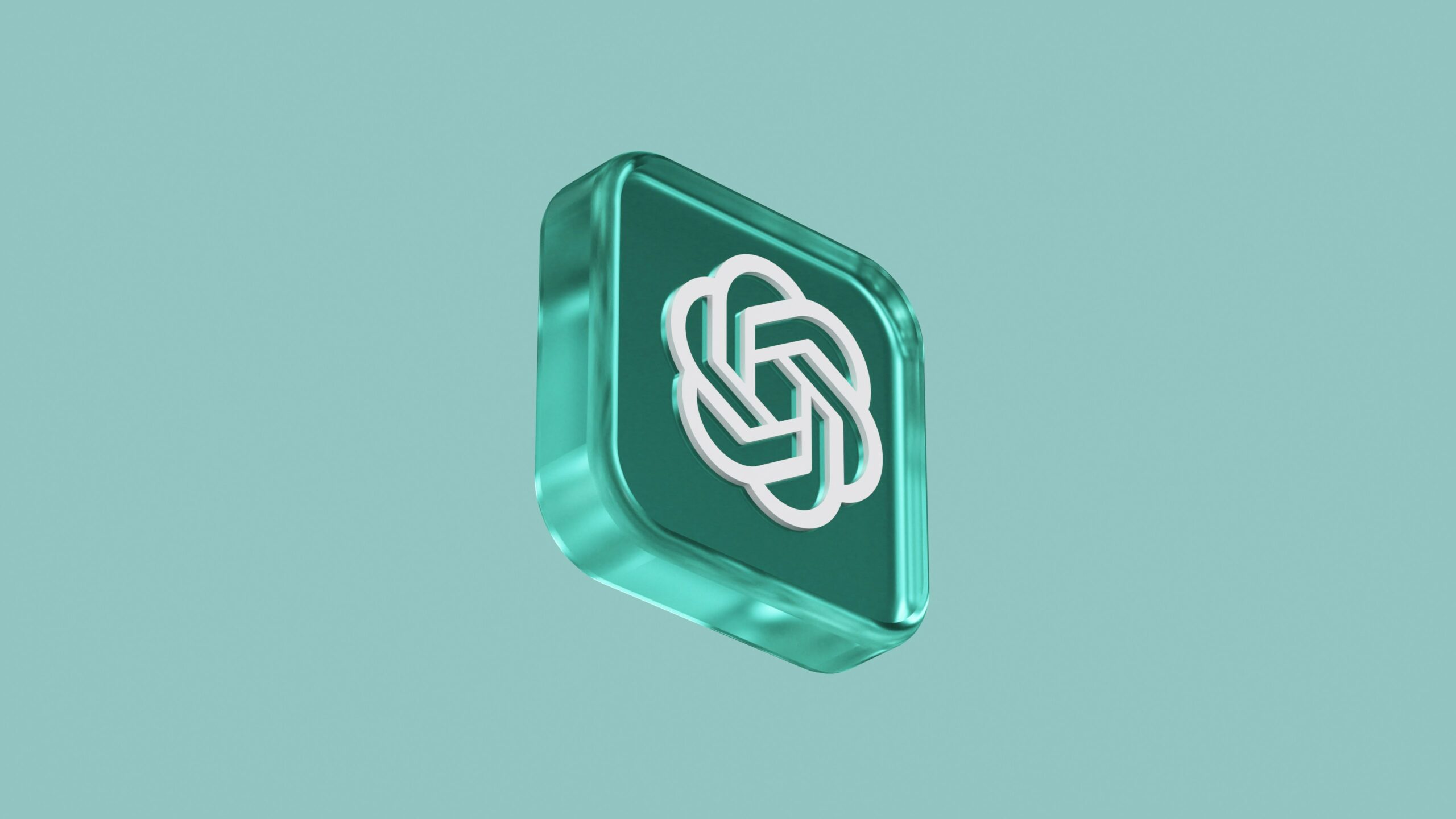 Logotipo de ChatGPT sobre una pieza de cristal verde