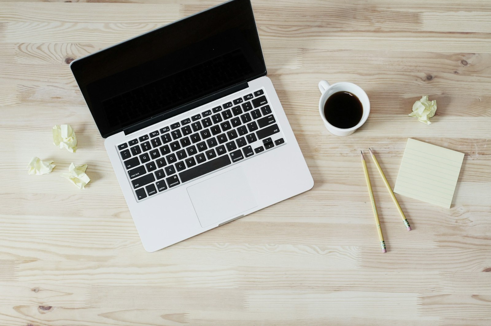 A person preparing a document on a laptop