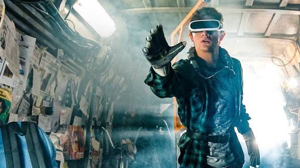 A young man immerses himself in a virtual world with a VR headset