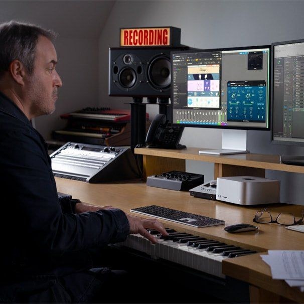 A person working with a Mac Studio in a studio, official Apple photograph