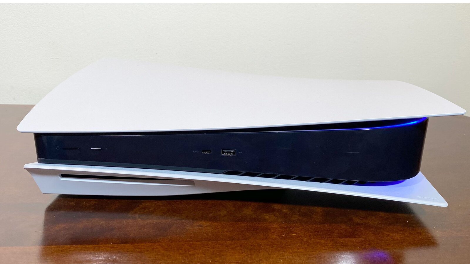 A disc-drive PlayStation 5 placed horizontally