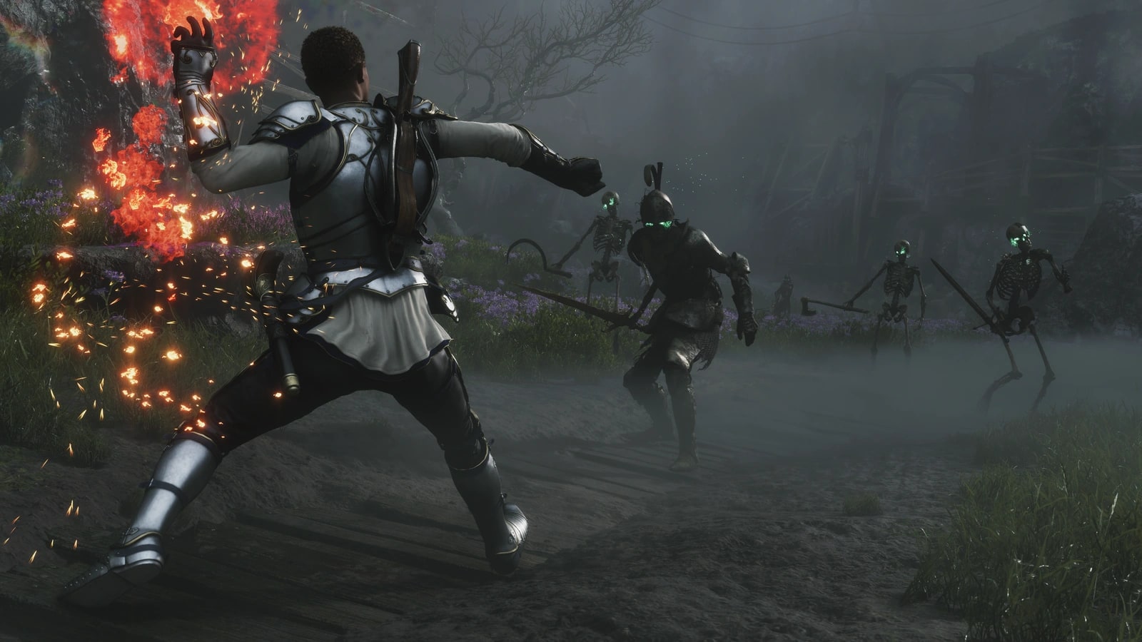 Fable's Hero readies a fire spell against a group of skeletons