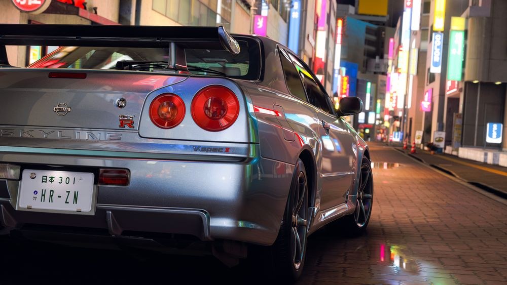 A Forza Horizon 6 car drives through a neon-lit Tokyo street