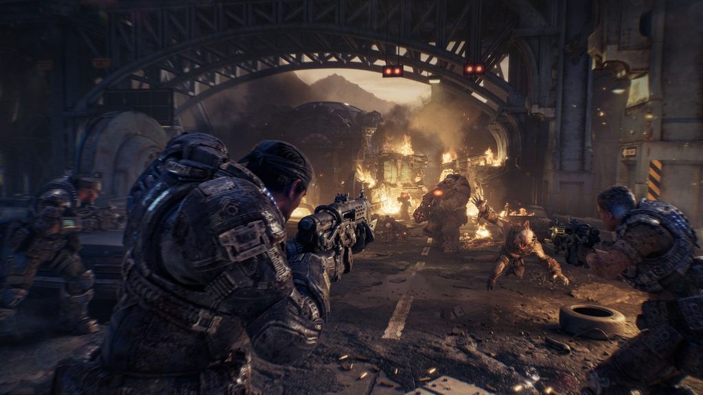 A squad fighting Locust among damaged buildings