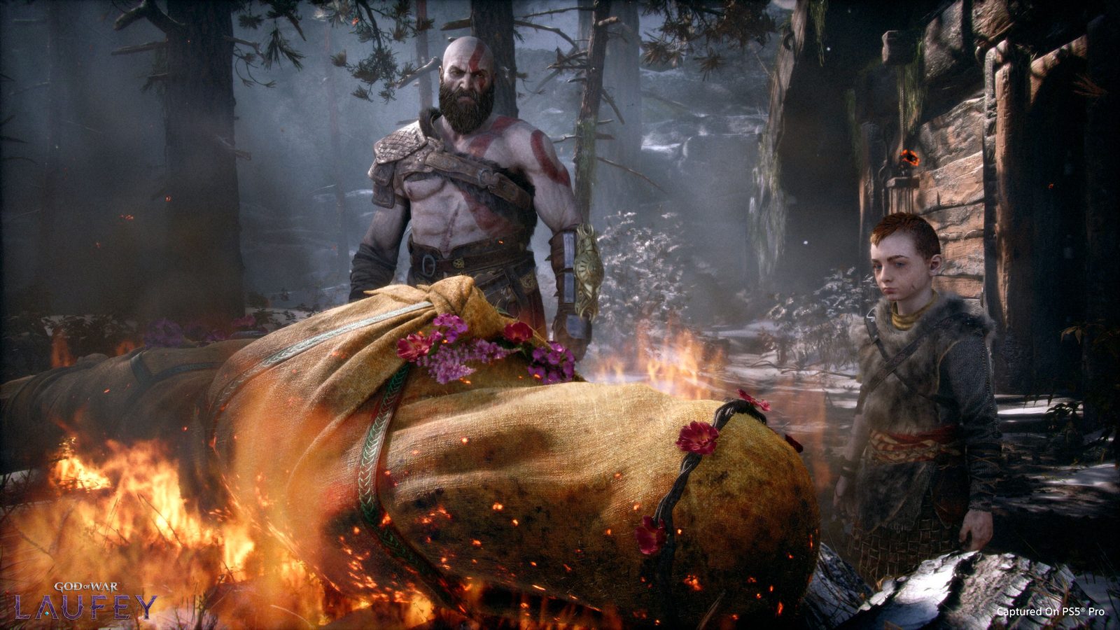 Kratos and Atreus say goodbye to Faye at her funeral pyre in an official God of War Laufey image