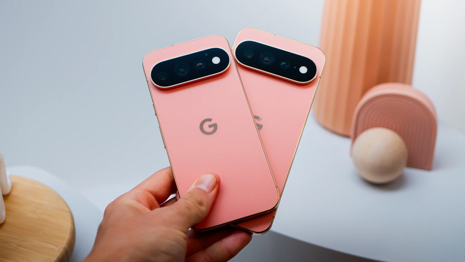 Two Google Pixel 11 Pro phones in Canyon seen from the rear