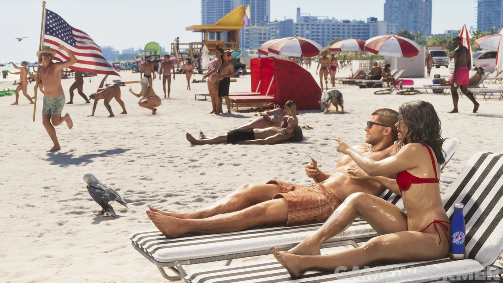 Crowded Vice City beach with swimmers, umbrellas and buildings behind it