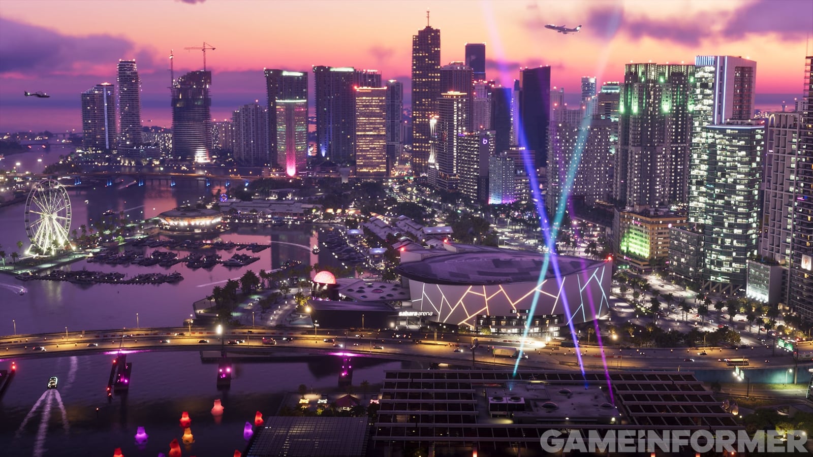 Panoramic view of Vice City at dusk, with buildings, water and a lit stadium
