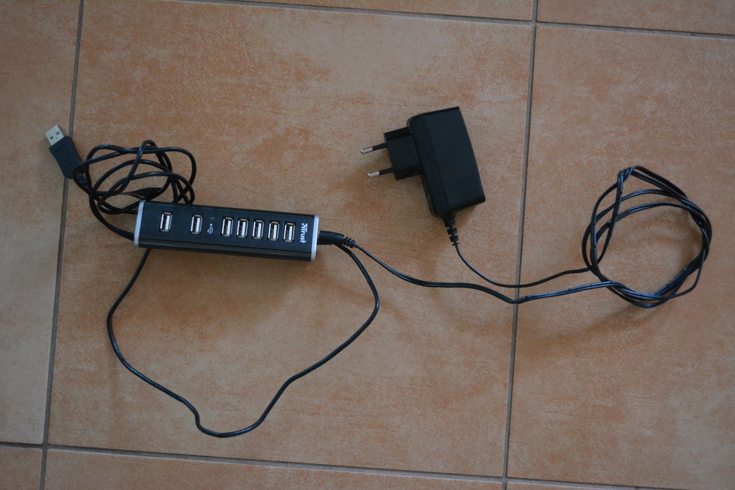 Seven-port USB hub with its computer cable and separate AC power adapter