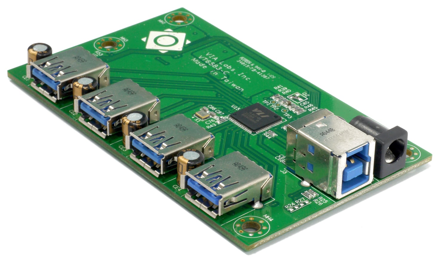 VIA VL811 reference board with four USB-A ports, a computer-facing USB-B port and a power socket