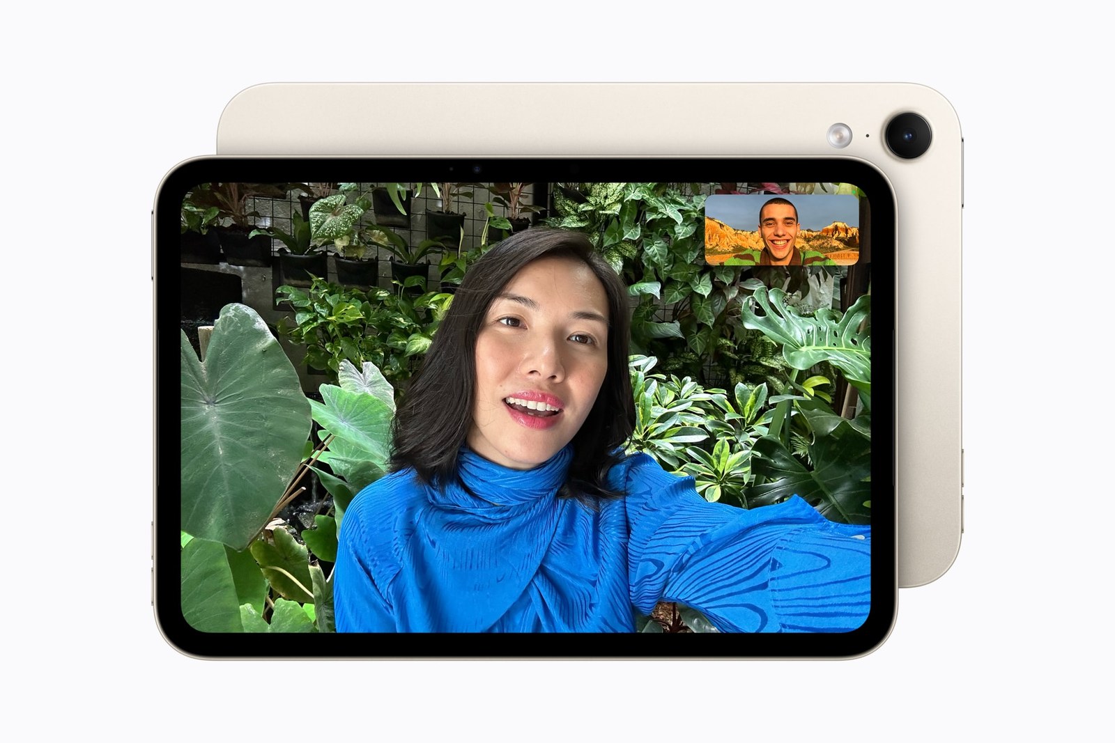A FaceTime call on a starlight iPad mini held in landscape orientation