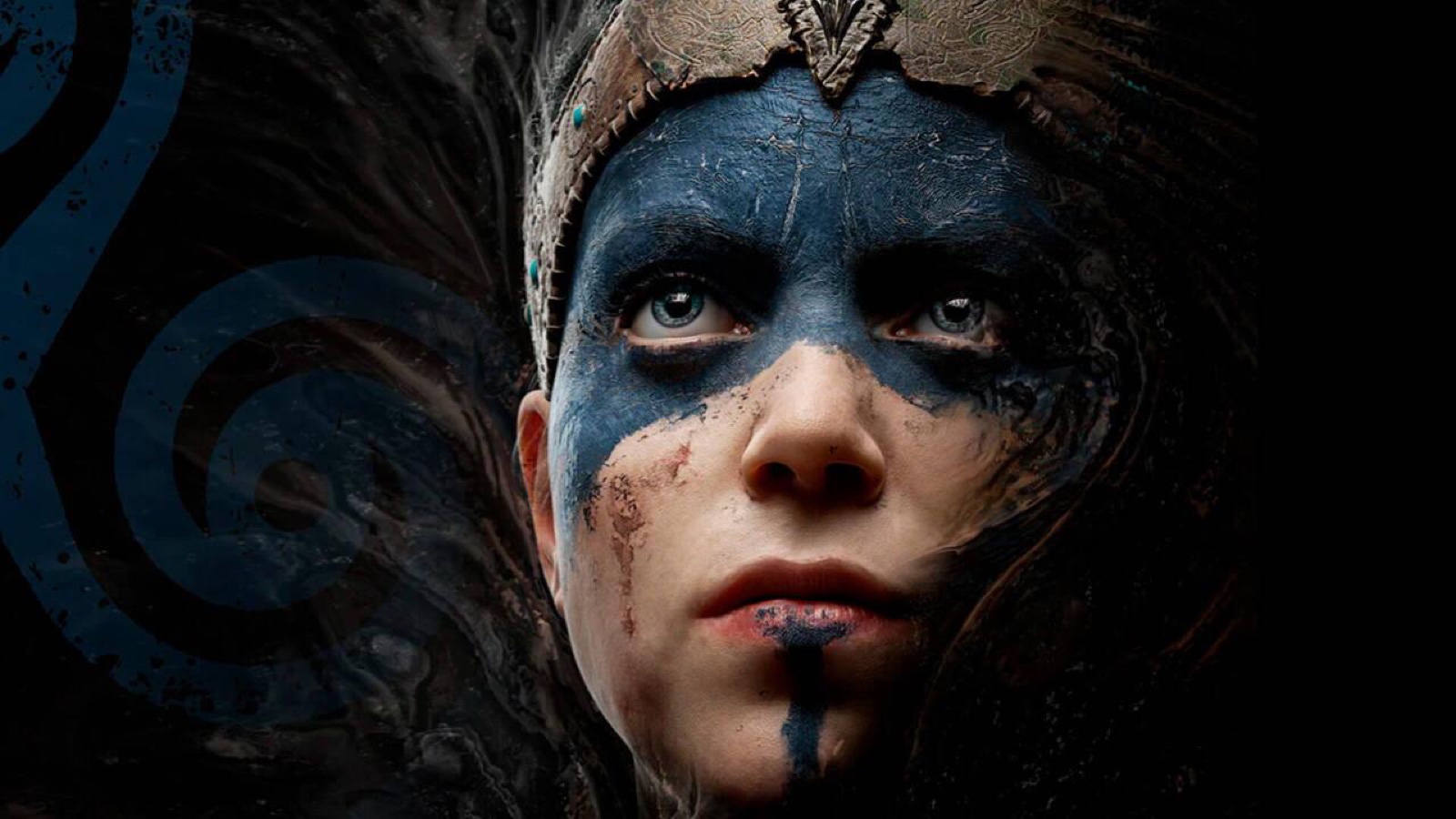 Senua looks ahead with blue paint across her face