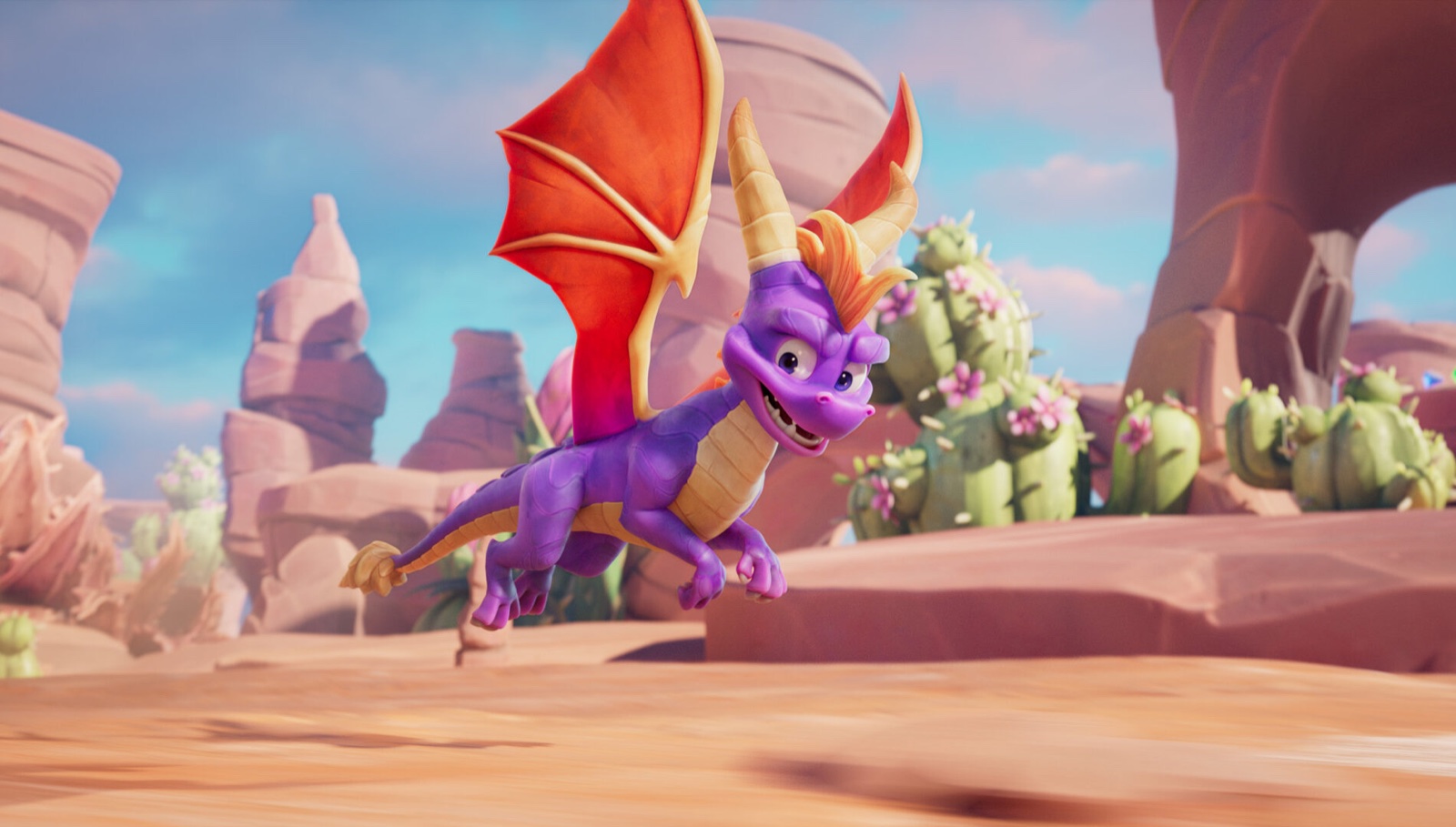 Spyro flies between rock formations in A Realm Beyond