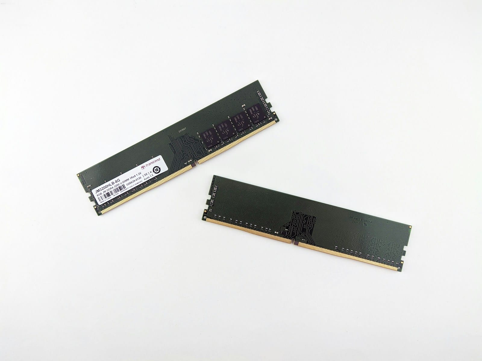 Two RAM modules on a white surface