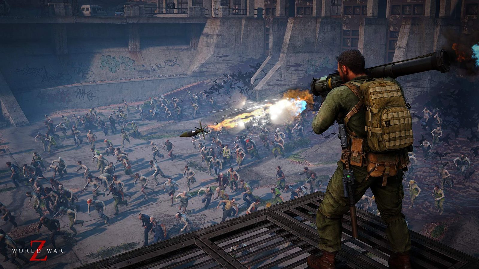 Four players shoot together at a horde of infected in a co-op game