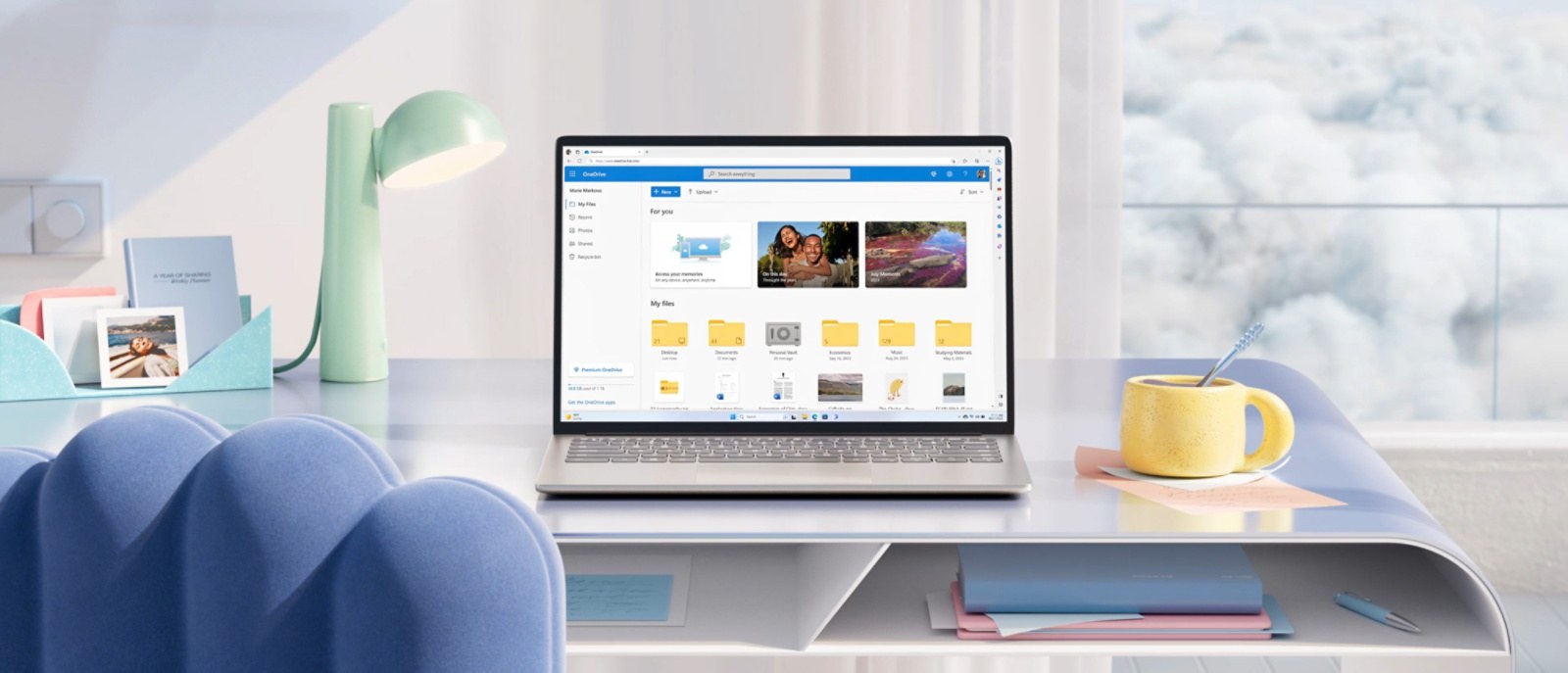 OneDrive open on a laptop on a desk