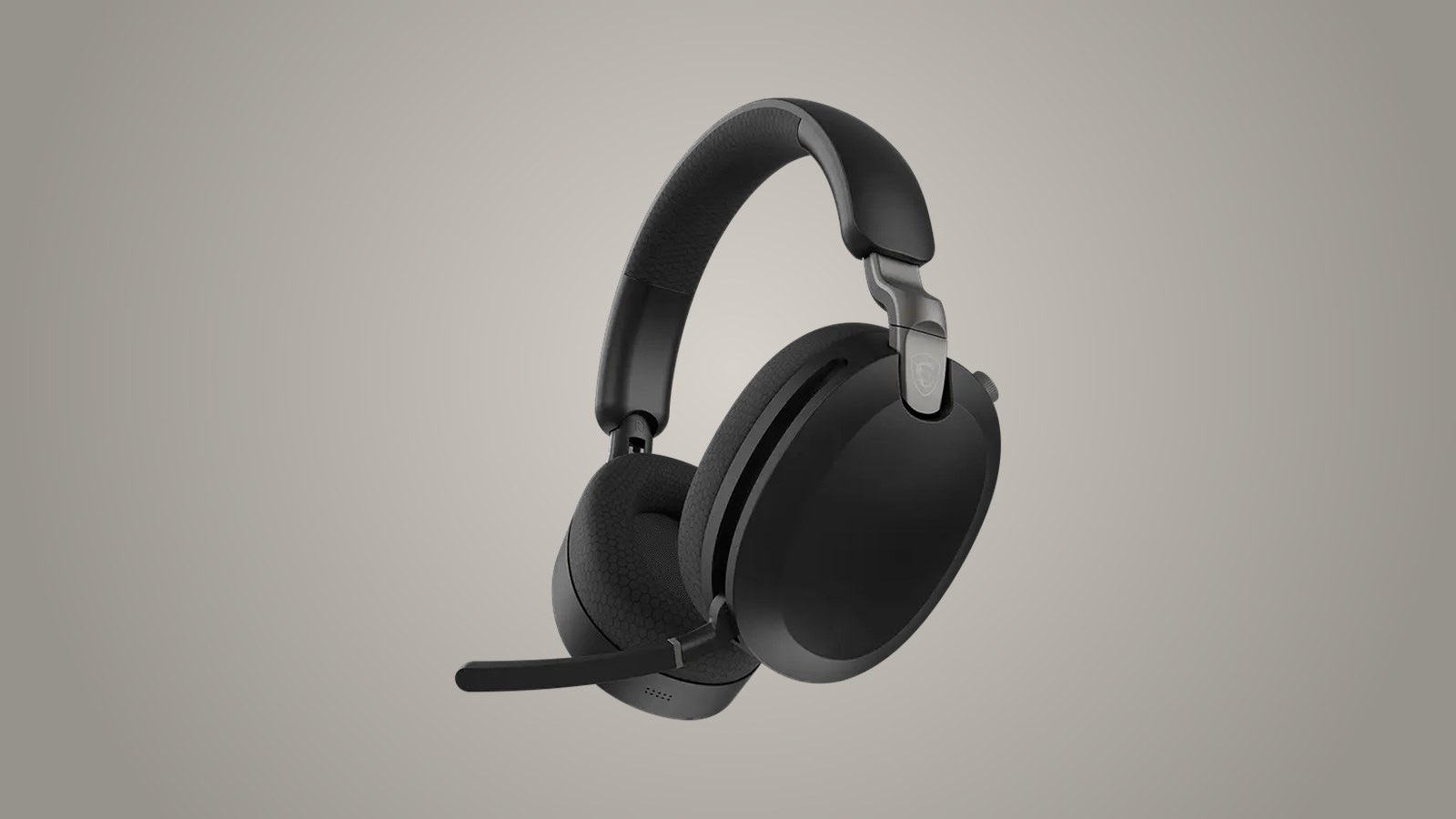 Side view of the black MSI Maestro 500 Wireless with the mic boom lowered and the padded headband, on a warm gray backdrop