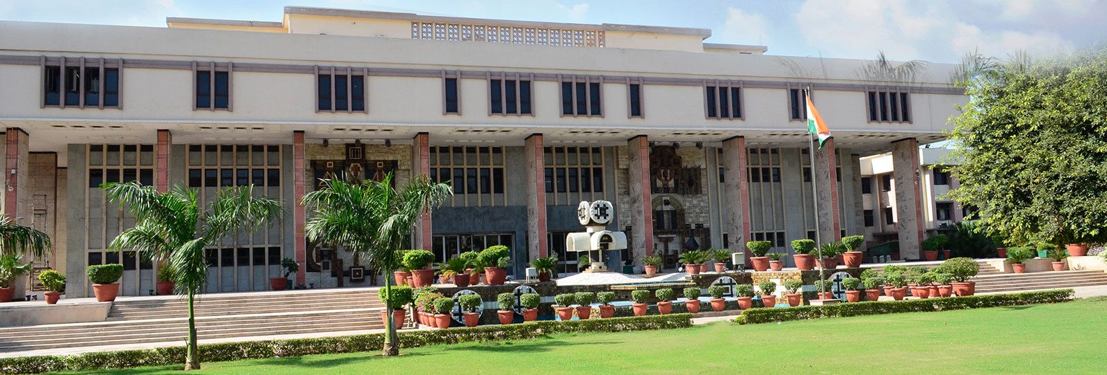 Official facade of the Delhi High Court with the Indian flag