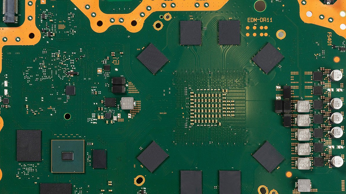 The back of the PS5 Pro motherboard, with eight GDDR6 memory chips arranged in a ring around the processor area