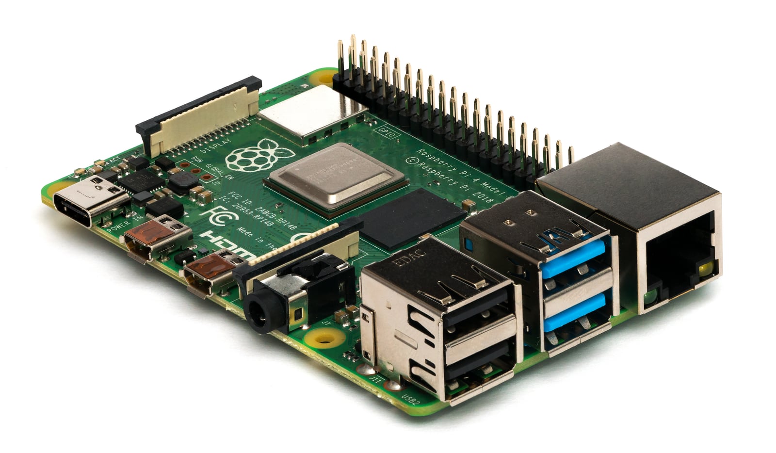 Raspberry Pi 4 Model B at an angle, showing its ports and full pin header