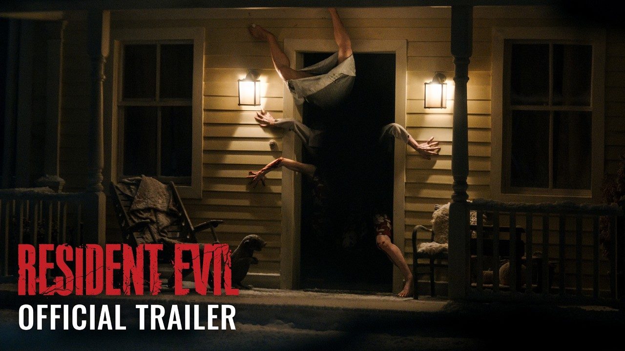 Several creatures burst through a house door in the official Resident Evil trailer