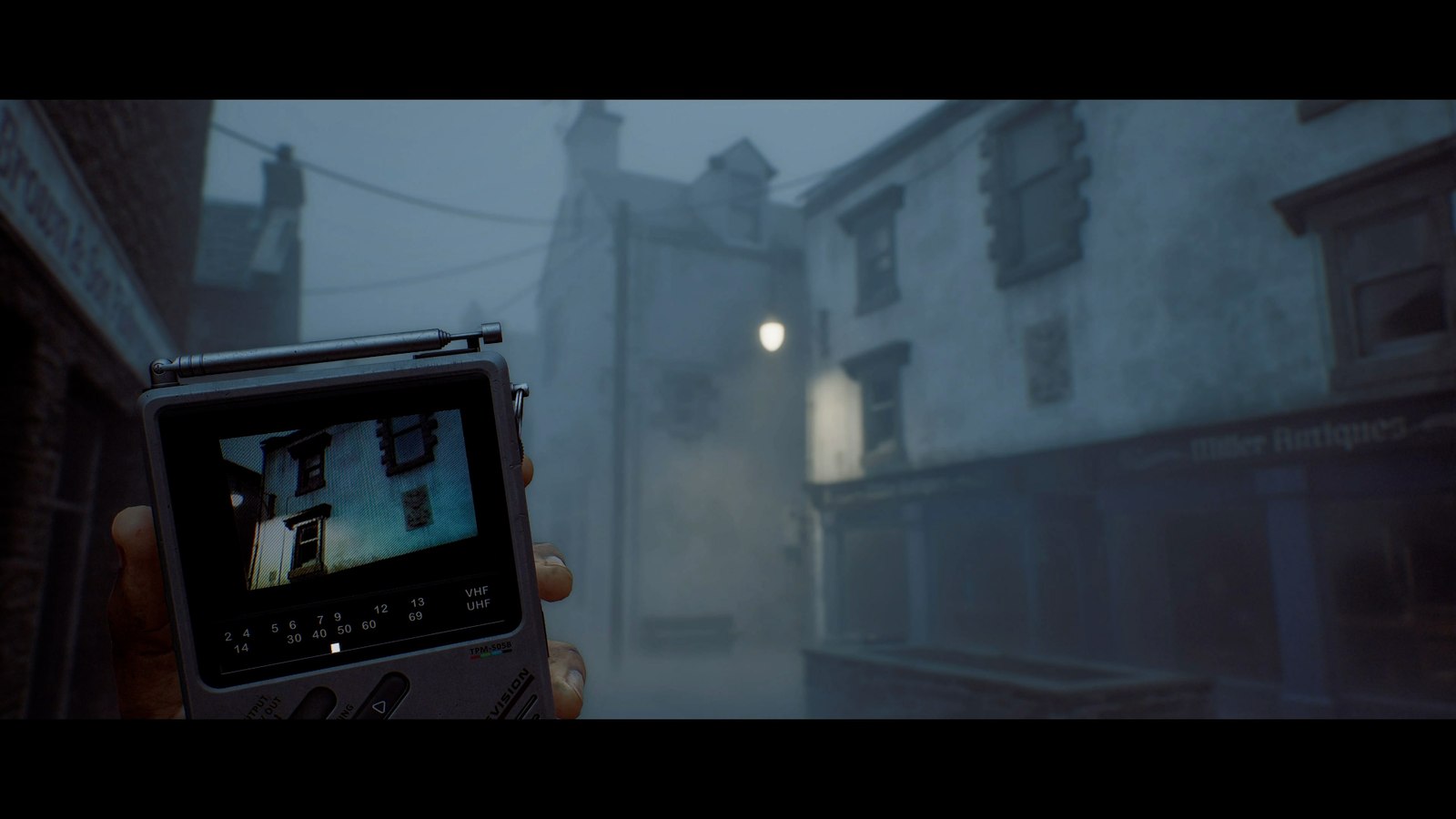 The CRTV shows a house through the fog in Silent Hill: Townfall